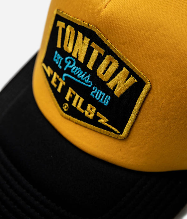 Tonton et Fils - Casquette "Trucker" - Vue écusson coloris Noir - orange